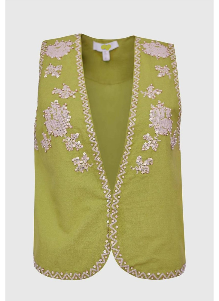 Chaleco verde con bordados